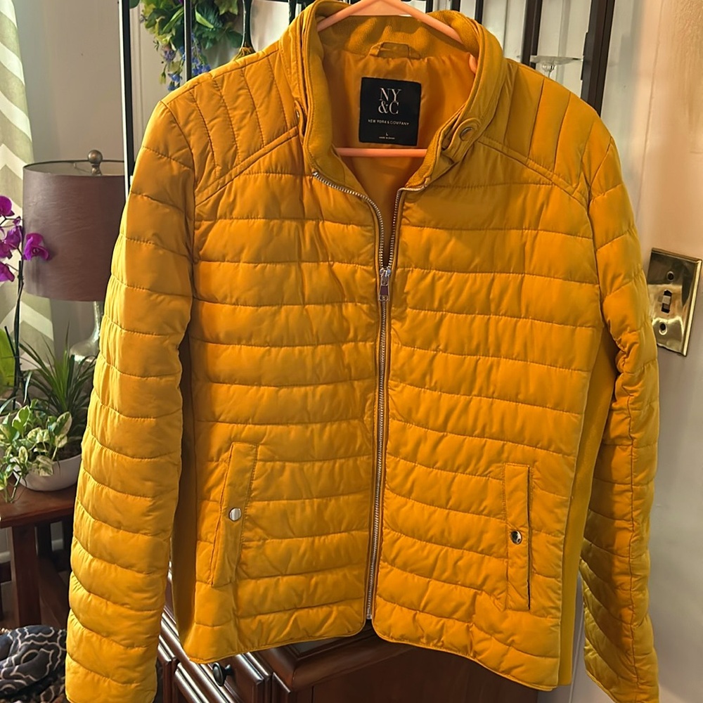 New York and Company gold puffer jacket with zipper.